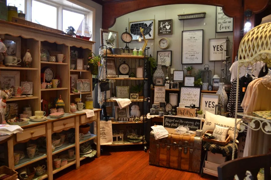 interior of Mulberry Mill with decorative wooden signs, clocks, dish ware, and more