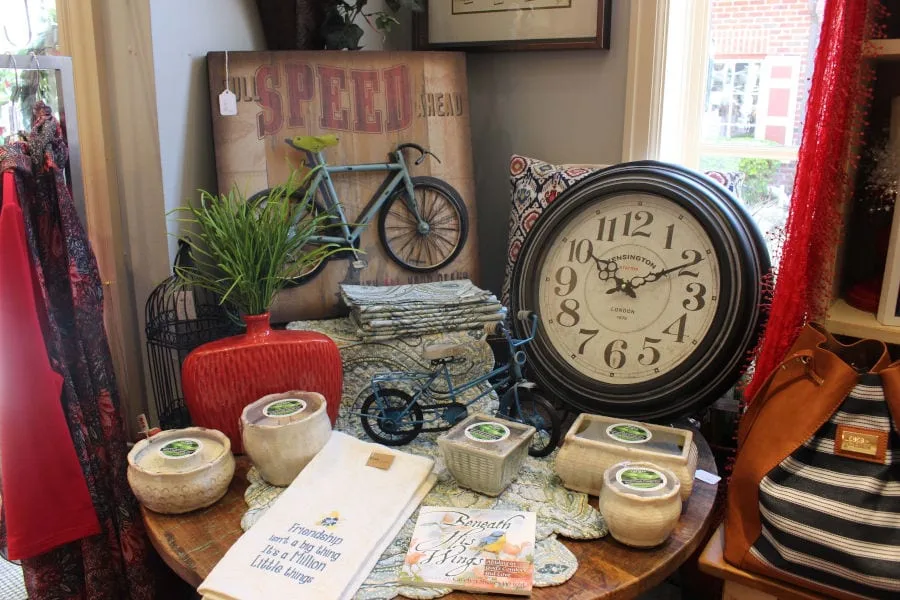 display in Mulberry Mill with decorative clock, pottery, and linens
