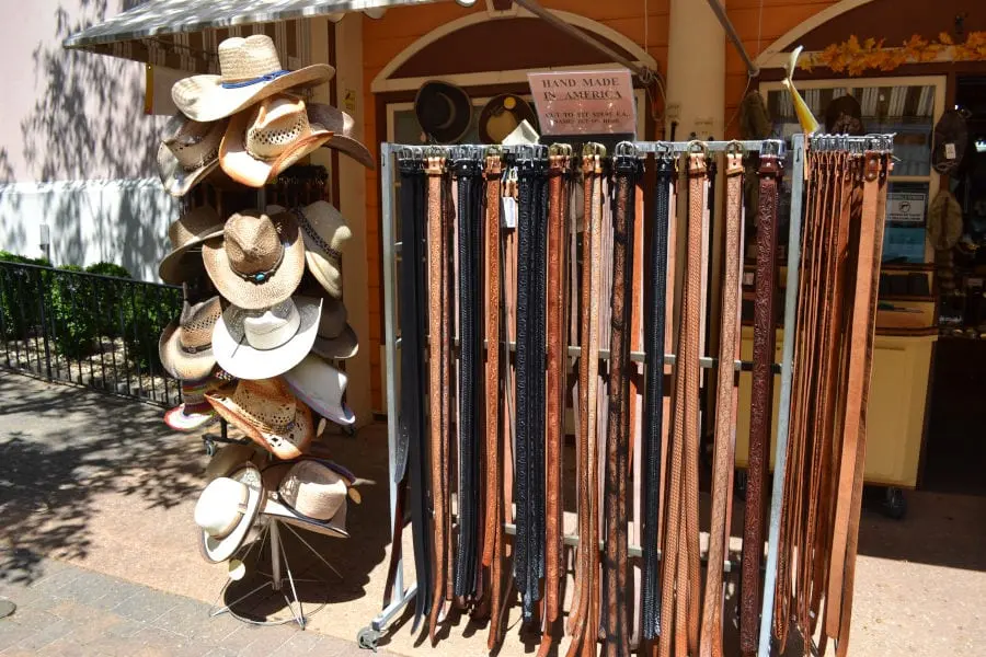 outdoor display of hats and belts at Sunrise Leatherworks