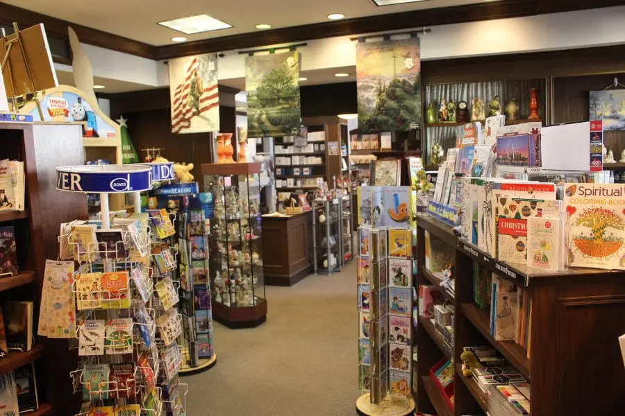 interior of T Charleston Book Store with cards, banners, and other book displays