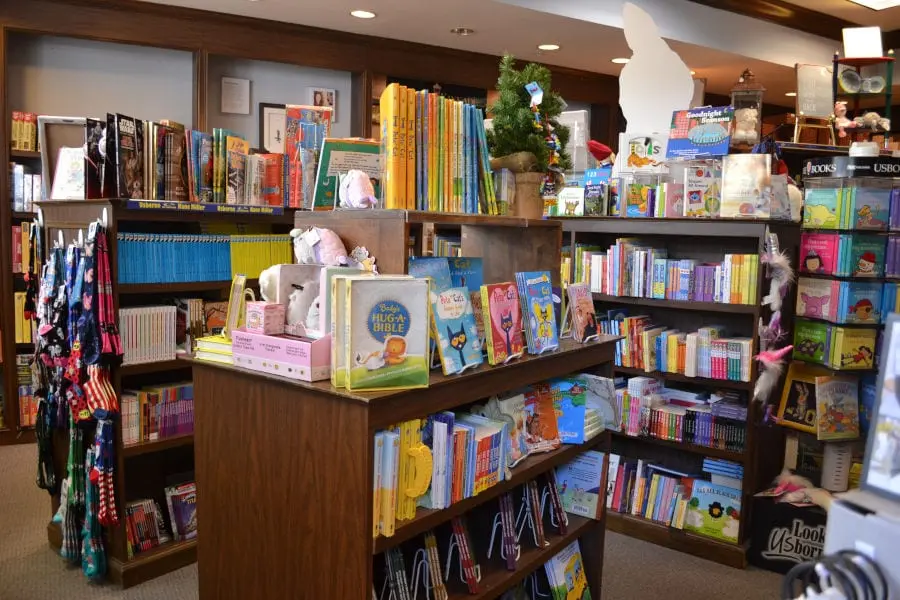 many shelves of children's books at T Charlestons Books and Gifts