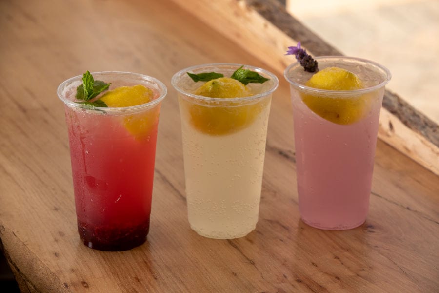 three cups of different types of lemonade