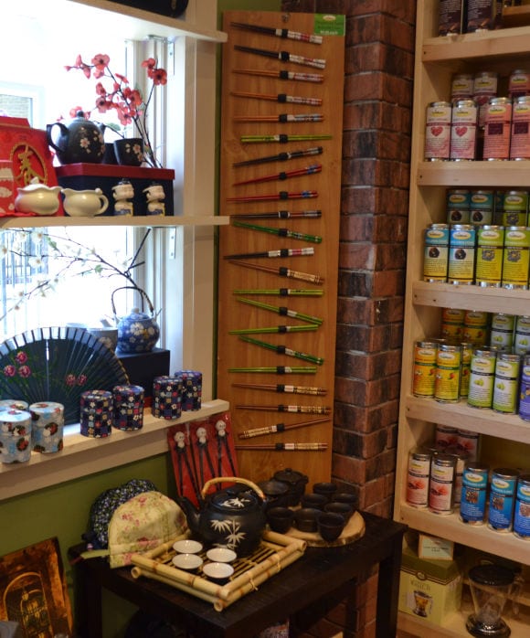 wall of chop sticks and ceramic pottery for sale at TeaMaze Tea Shop