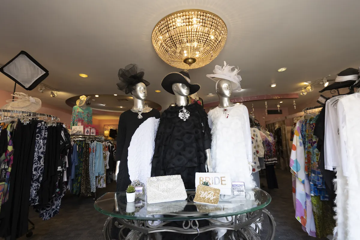 Interior of Grand Glitz with Mannequins showcasing clothing items
